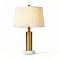 Table lamp with gold metal base and white fabric shade 25 x 25 x 50cm